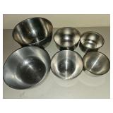 Six stainless steel bowls, various sizes