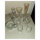 Eleven various glasses and mugs