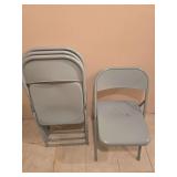 Four metal folding chairs