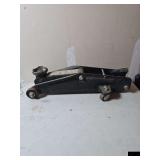 Roll around hydraulic floor jack. Operational. Tonnage unknown