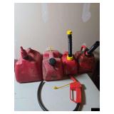 Collection of small gas cans.
