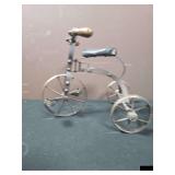Small metal tricycle.