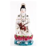 Porcelain Figurine of Deity Holding a Child