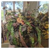 DECORATIVE ARRANGEMENT IN FOOTED POTTERY PLANTER