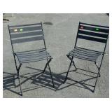 Two folding metal patio chairs