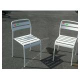 Two metal patio chairs
