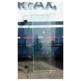 Two glass shower doors, one is 30 inch and