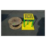 Spool of electrical wire and plastic long handled
