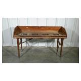 Potters bench with folding legs. One support is