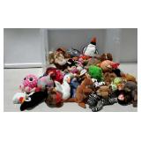 Small stuffed toys including lots of beanie