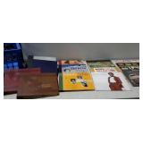 Records. Blue crate with nine 33 RPM records,