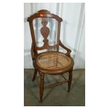 Oak framed, cane seated hip chair. Nicely carved