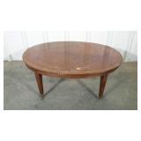 Oval coffee table with side pull outs, on