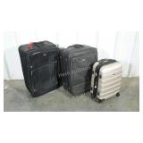 Three pieces of luggage. Two black soft side