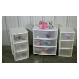 Three sets of plastic drawers and contents.