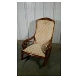 Upholstered parlor rocker. Wooden frame needs