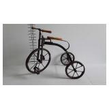 Decor tricycle, note one wheel is missing a piece