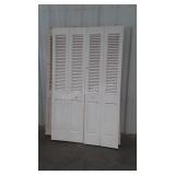Two sets of 24 inch closet bifold doors, one is