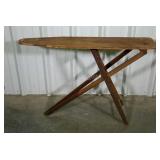 Wooden folding ironing board.