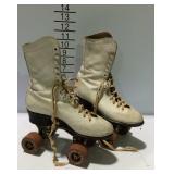 Pair of vintage roller skates with box