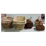 Group of four laundry baskets and smaller decor