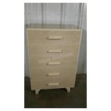 Five drawer laminated chest of drawers.