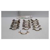 Twenty drawer pulls, 19 matching brass finish and