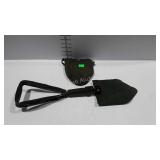 Military green trench shovel with storage pouch