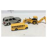 Toy Ertl tractor, matchbox bus, and a SUV