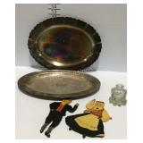 Two plated serving platters, glass ink bottle, and