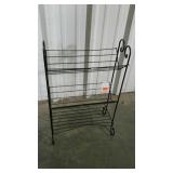 Iron Works book rack. Has a bent piece on lowest