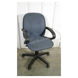 Blue upholstered office chair. Swivel and