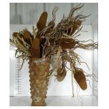 Pottery vase with faux dried flowers. Vase is