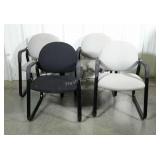 Four conference room upholstered chairs. Three