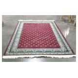 Small area rug in burgundy with floral border a