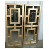 Pair of gold painted wall mirrors. Geometric