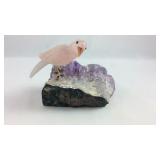 Crystal bird on rock