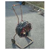 Metal cart with extension cord on it