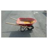 Red metal wheel barrow, will need air in tire