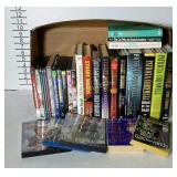Flat of mixed media. Books, DVDs, PS2 game, etc.