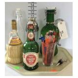 Tray with beer bottles, bottle stopper, and drink