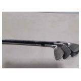 Group of four golf clubs