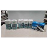 Group of Kirkland paper towels and trash bags