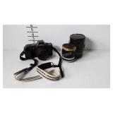 Canon T70 35mm camera with neck strap, and1