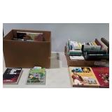 Two boxes of paper back and hardback books