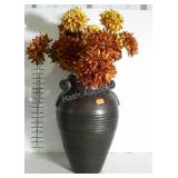 Large urn with faux flowers. Nice heavy vase.,