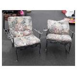 Two metal patio chairs with cushions one is a