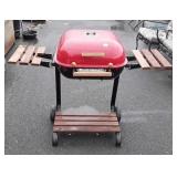 Meco brand charcoal grill, wood sides do fold
