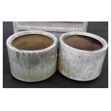 Two large plastic planters, 30 inches in diameter