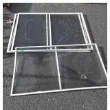 Group of four window screens, three are 39 by 32